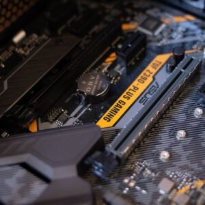 Detailed view of a gaming motherboard with capacitors and microchips.